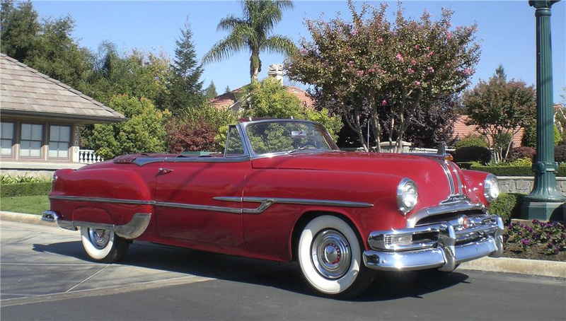 Illustration for article titled Convertible early 50s Pontiac(?) Towing Camper